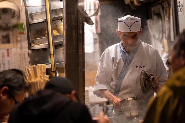 Busy restaurant kitchen with chefs preparing dishes
